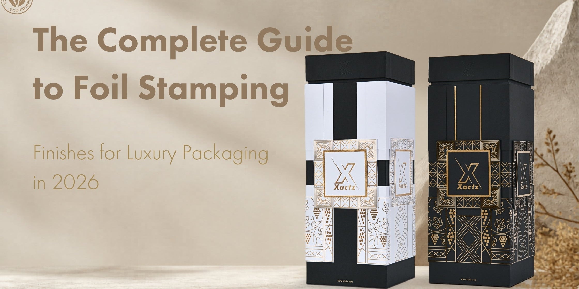 Blog post cover for The Complete Guide to Foil Stamping Finishes for Luxury Packaging in 2026, displaying an eco-friendly badge next to premium black and white custom rigid column boxes by Xactz Packaging.