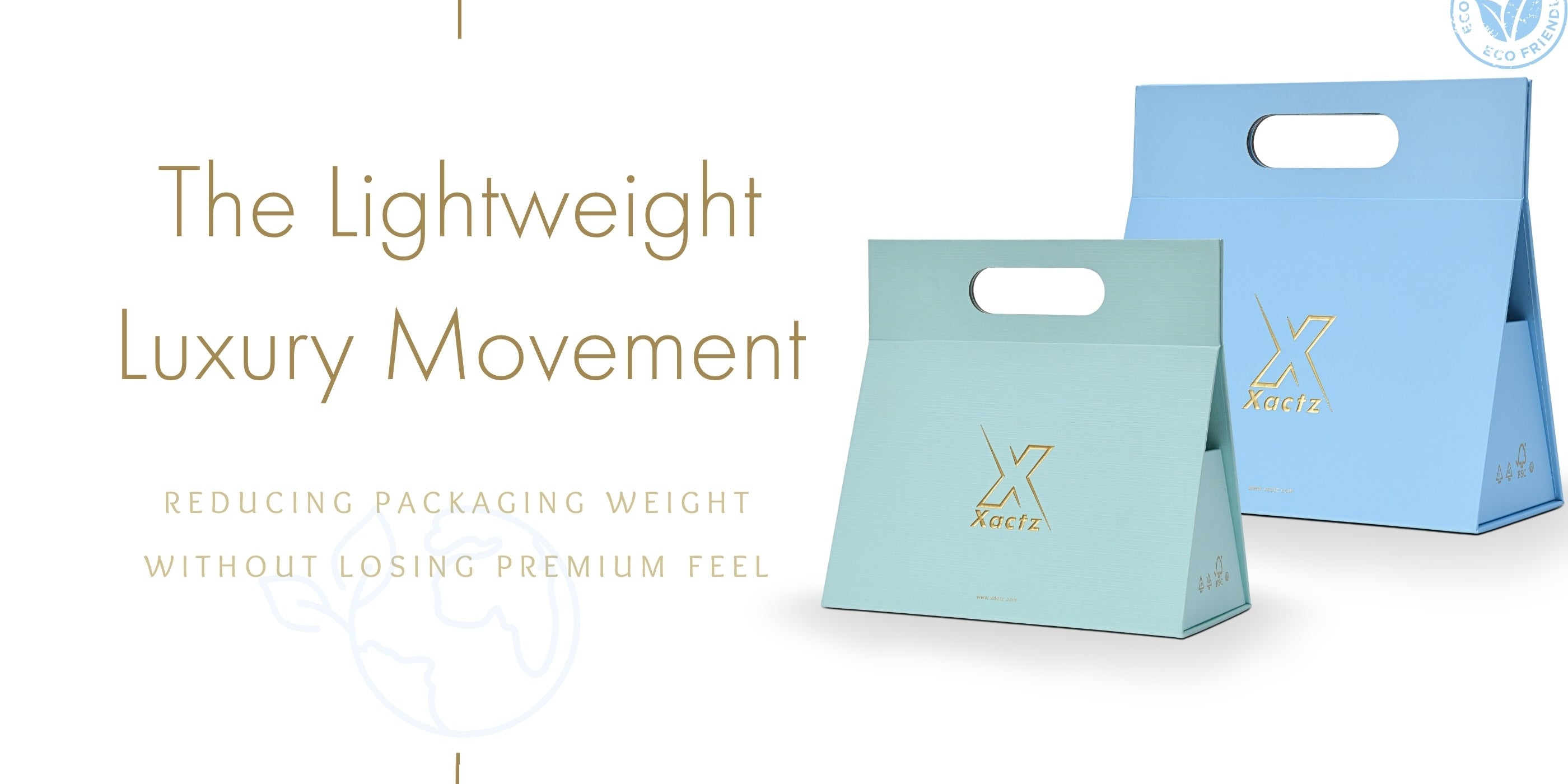 Xactz lightweight luxury custom packaging boxes in mint green and sky blue with gold foil logo stamping and die-cut handles, eco-friendly premium packaging that reduces weight without losing luxury feel.
