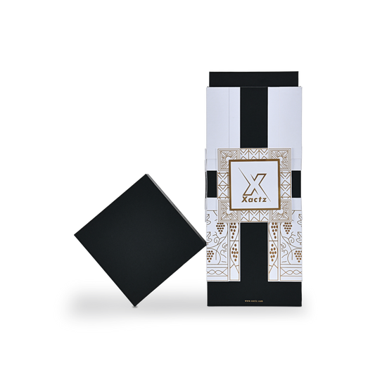 Custom black rigid wine gift box with the matte black square lid removed and tilted at a diagonal angle beside the white and gold foil base showing the collared lid and base construction and the full gold foil grape vine illustration on the body