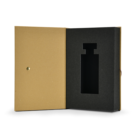 Slightly angled open view of a custom book style fragrance box displaying the gold metal rivet on the inner cover and the protective black EVA foam insert designed for perfume bottles
