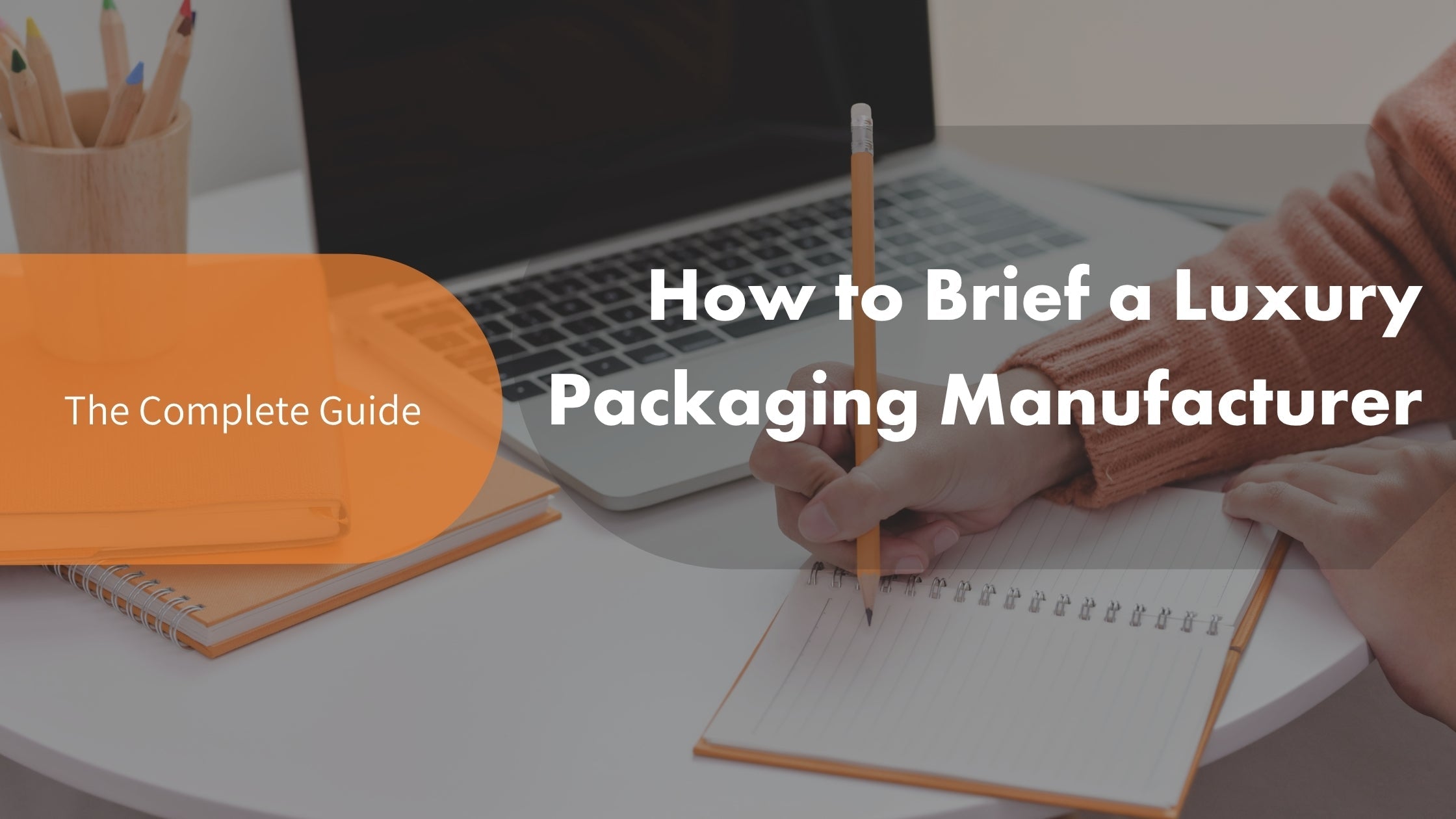 A brand manager drafting a production specification brief for a luxury packaging manufacturer, featuring article title text reading "How to Brief a Luxury Packaging Manufacturer."