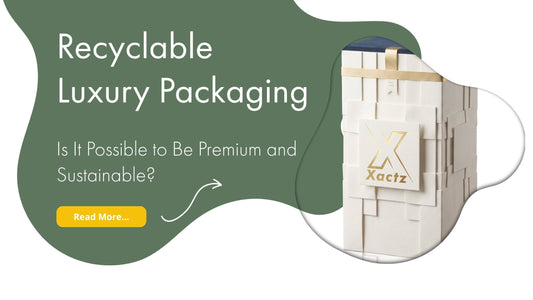 Xactz blog banner recyclable luxury rigid box white textured wrap gold foil logo ribbon sustainable premium packaging manufacturer