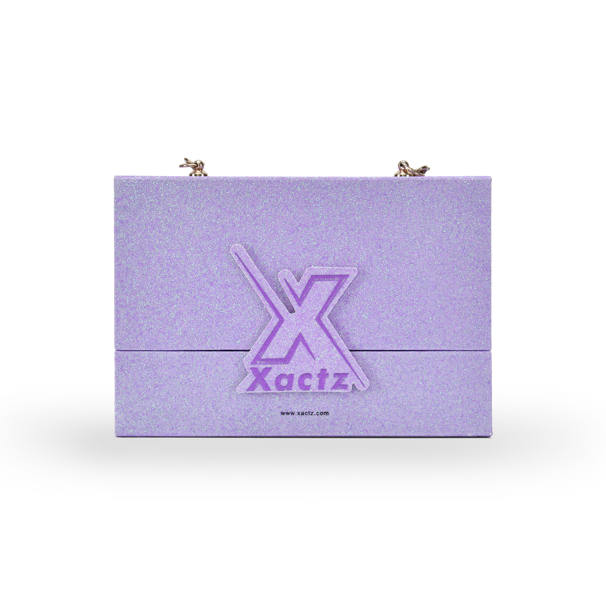 Custom purple glitter rigid makeup gift box with luxury chain handle showing the full front panel covered in iridescent purple glitter specialty paper with a large embossed purple gold foil Xactz logo in the center and two gold chain attachment hardware clips at the top corners