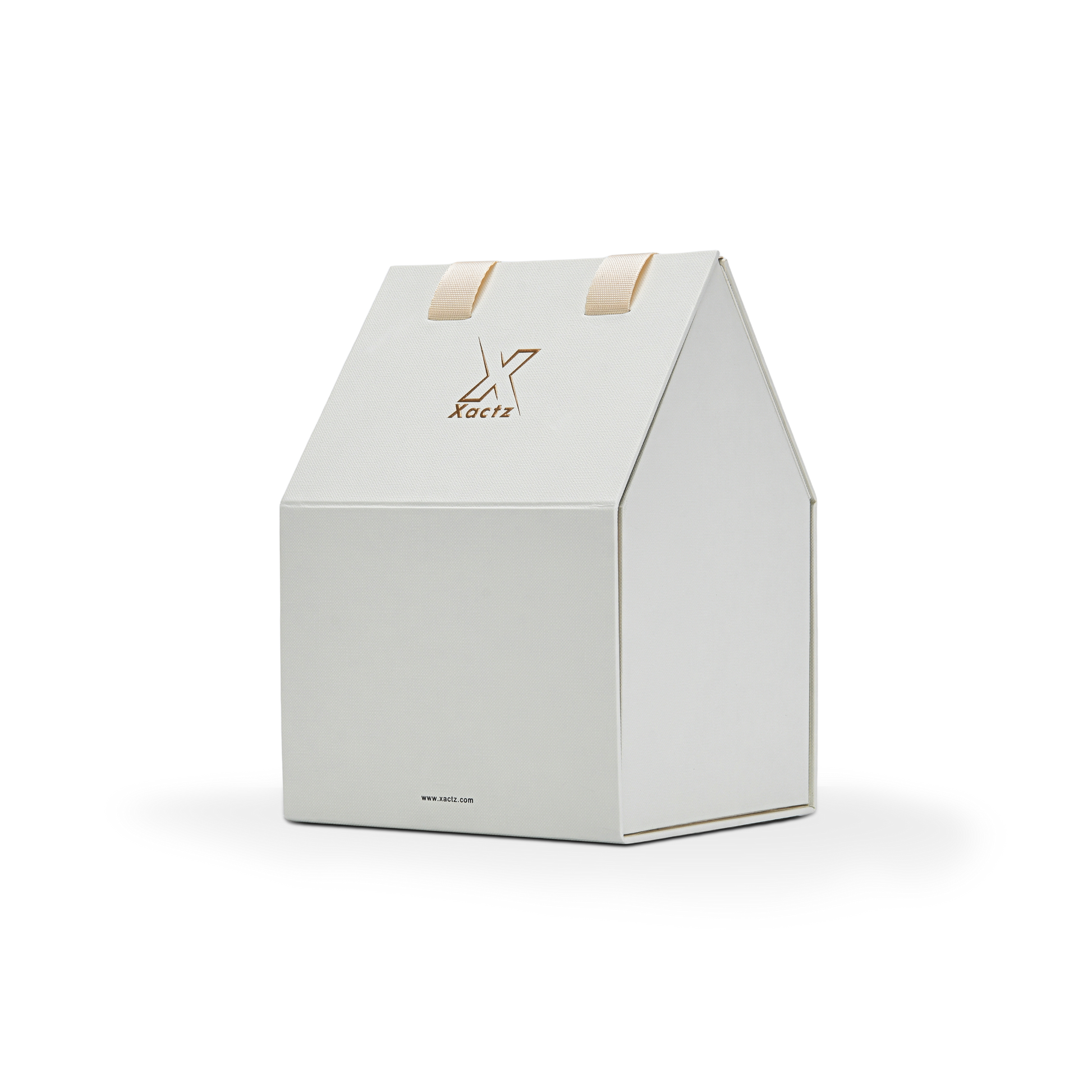 Three quarter angled view of a custom house shaped foldable packaging box displaying its unique architectural roof structure and clean cream white paper finish with a gold foil logo