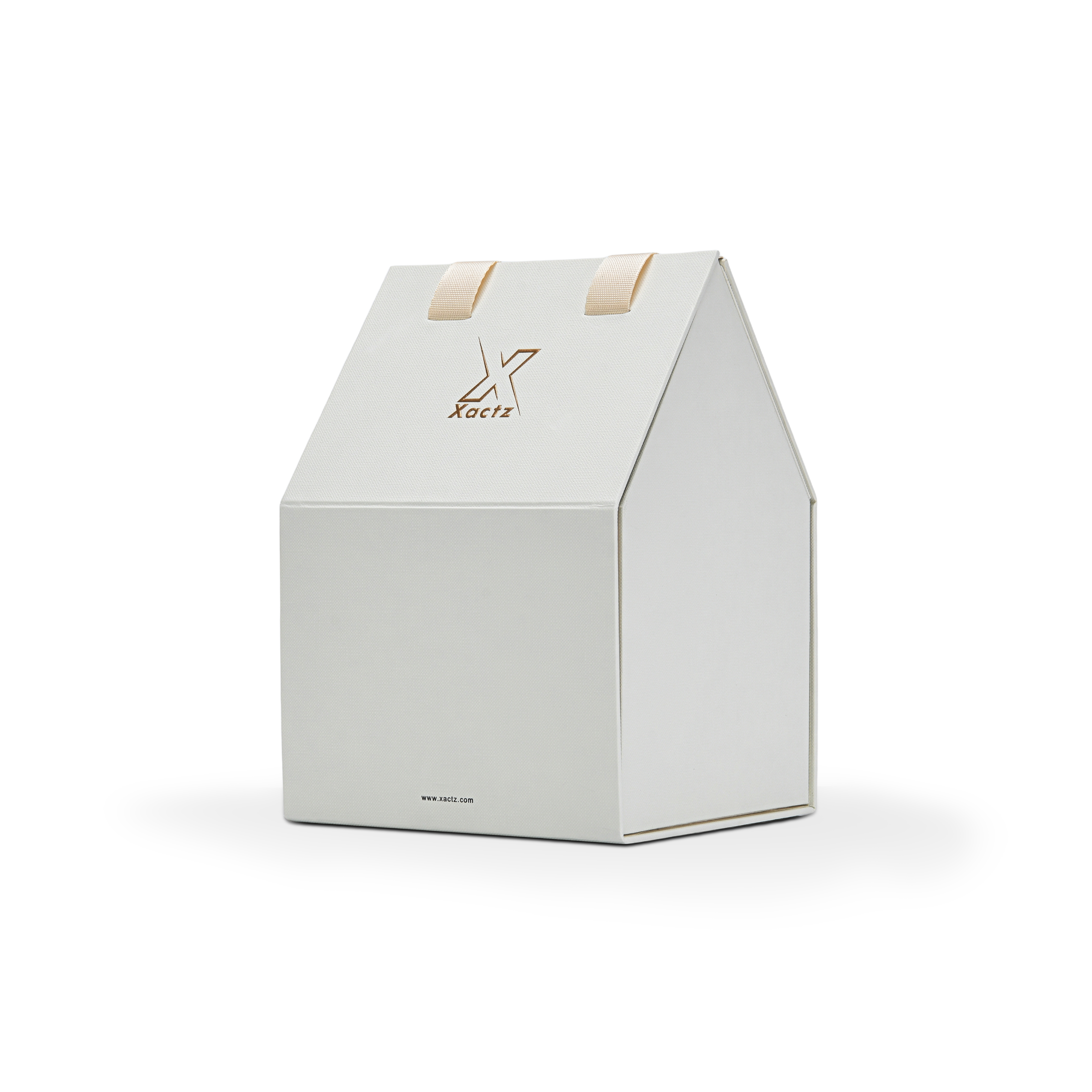 Three quarter angled view of a custom house shaped foldable packaging box displaying its unique architectural roof structure and clean cream white paper finish with a gold foil logo