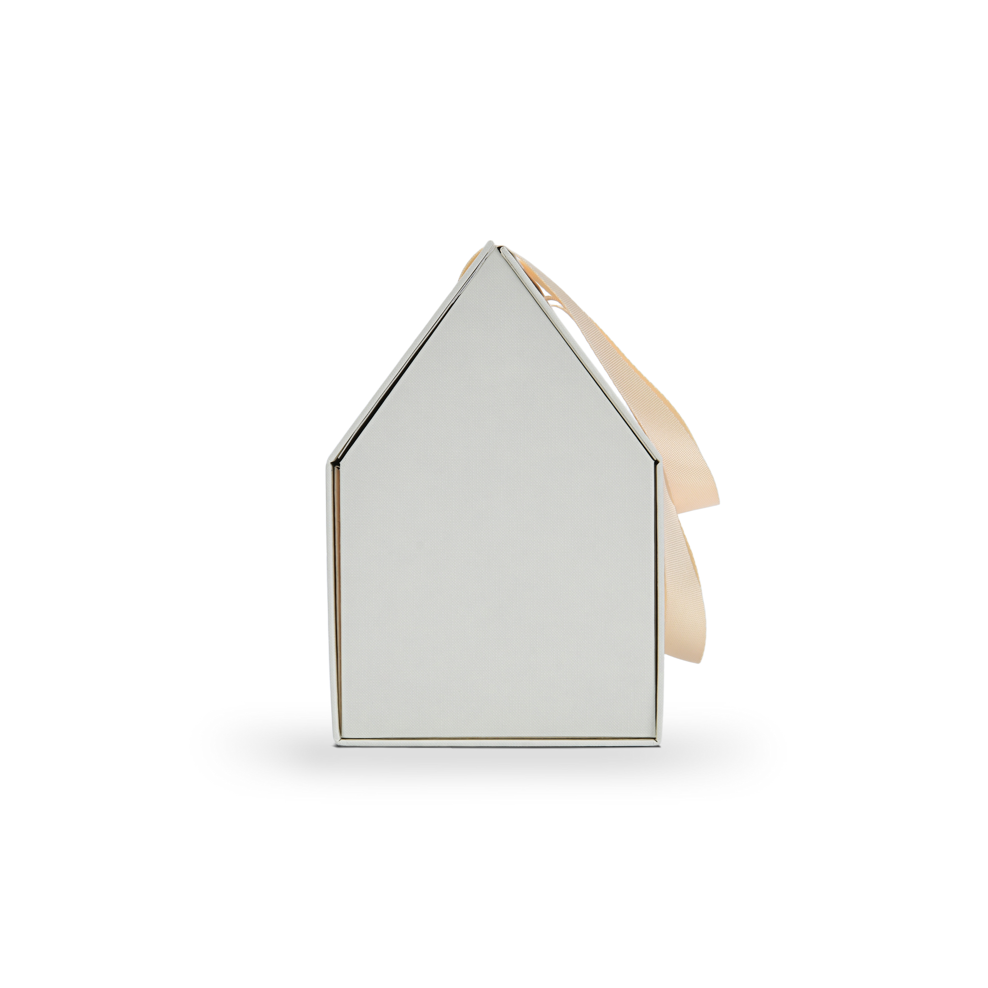 Side profile view of a closed custom house shaped foldable gift box showing the clean triangular roof line and the elegant beige ribbon handle draped over the side