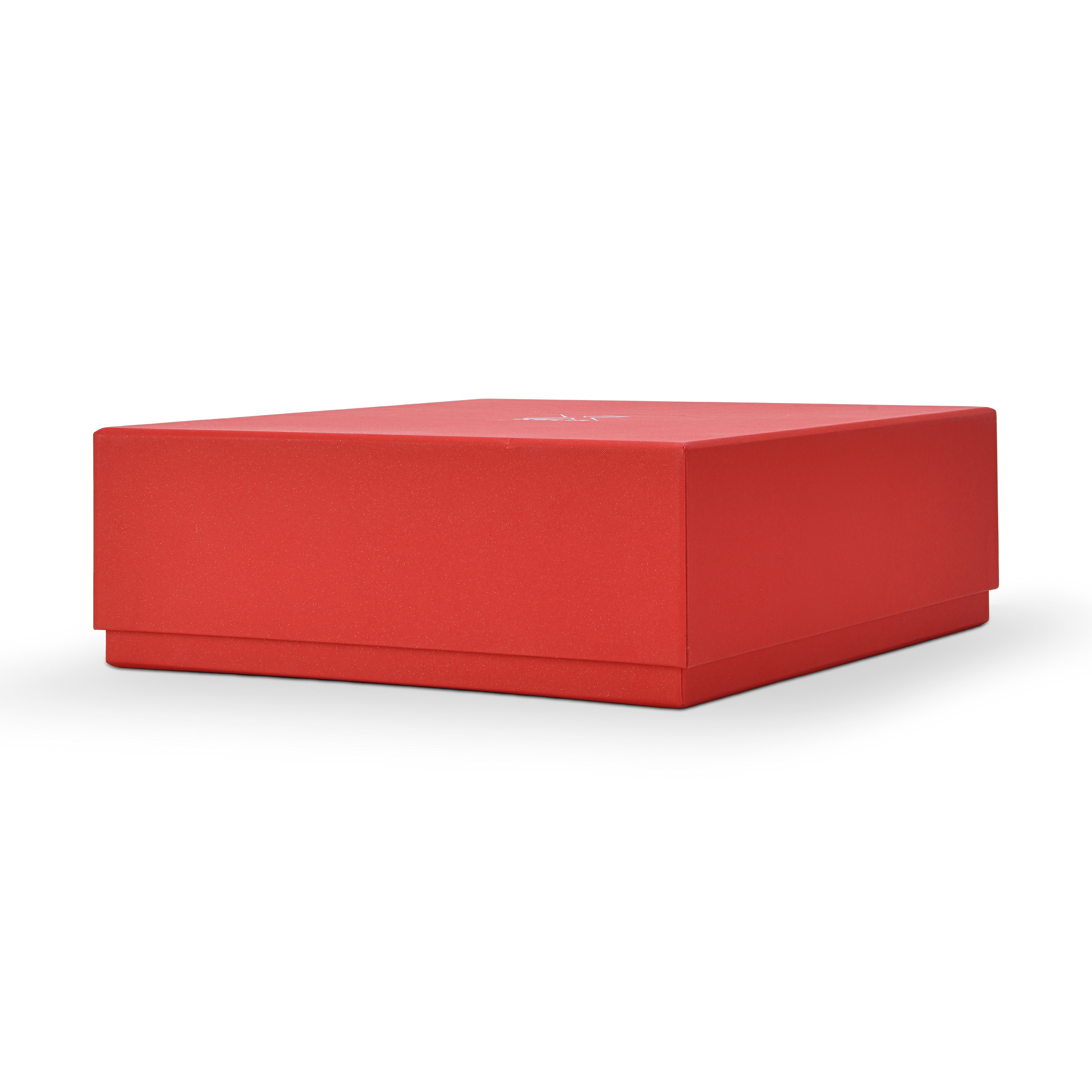 Low profile three quarter angled view of a custom red lid and base gift box for cosmetics shown in landscape orientation displaying the full red star rain specialty paper surface across the top lid panel and the clean fitted lid and base construction with the silver foil Xactz logo visible on the top face