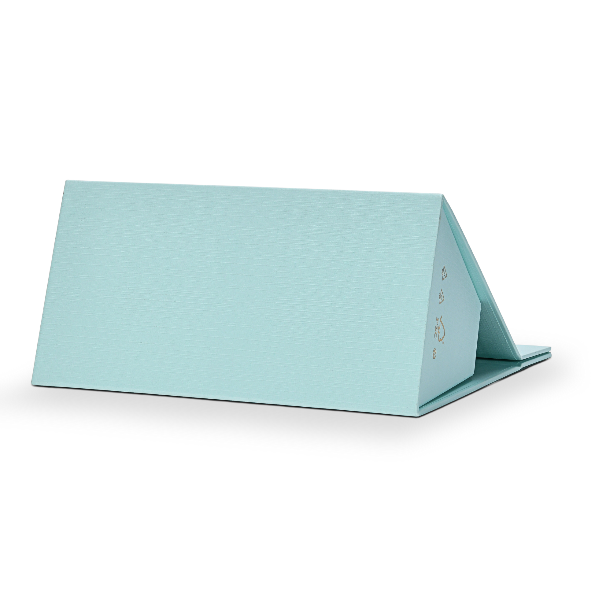 Custom foldable gift box bag with handle in sky blue linen specialty paper shown fully folded flat in a horizontal position displaying the clean back panel surface with the linen texture visible across the full width and FSC certification marks in gold on the right edge
