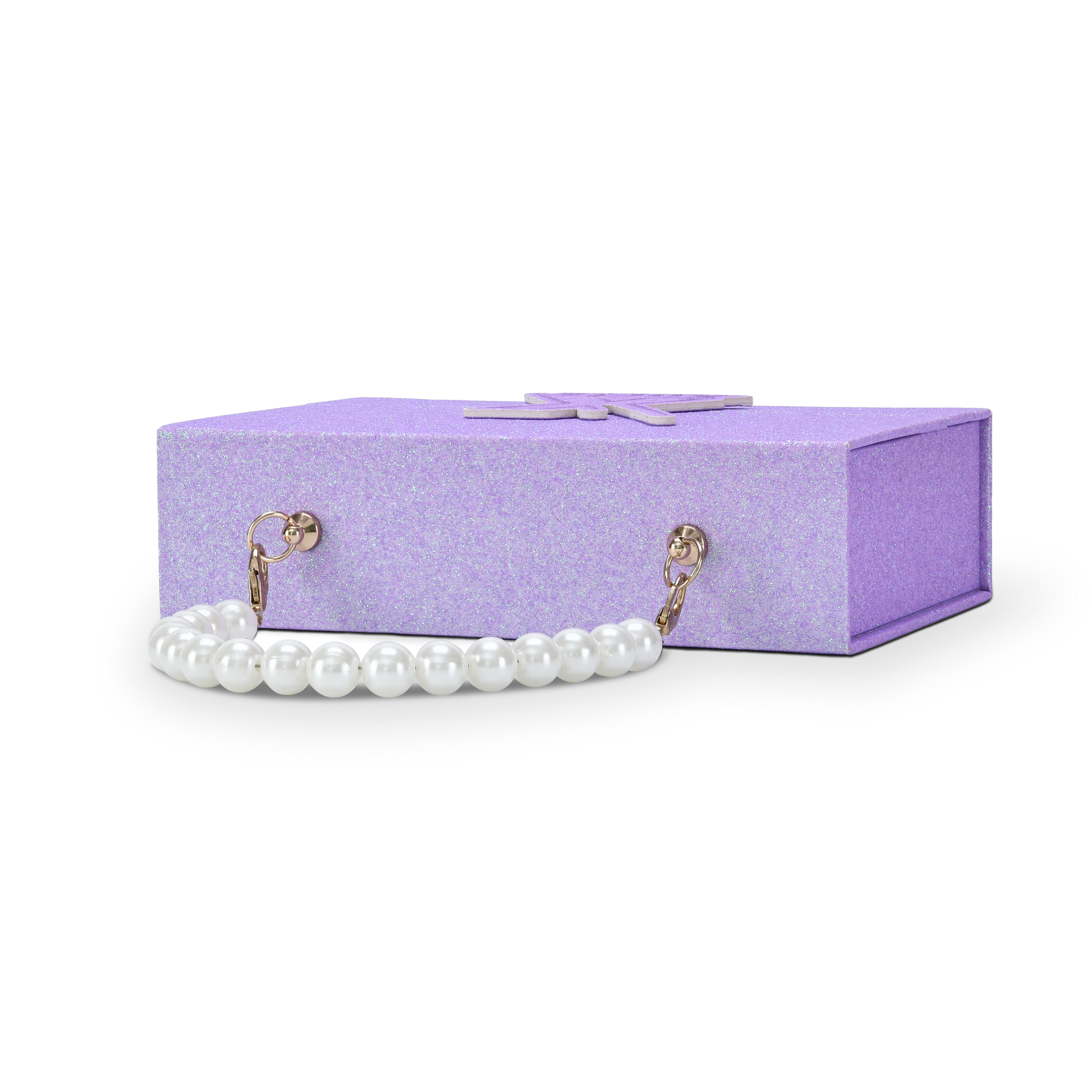 Side profile view of a custom purple glitter rigid makeup gift box with luxury packaging showing the box laid horizontally with the white pearl bead chain handle extended and attached to the gold hardware clips on the side panel displaying the full pearl chain handle construction and gold clasp detail