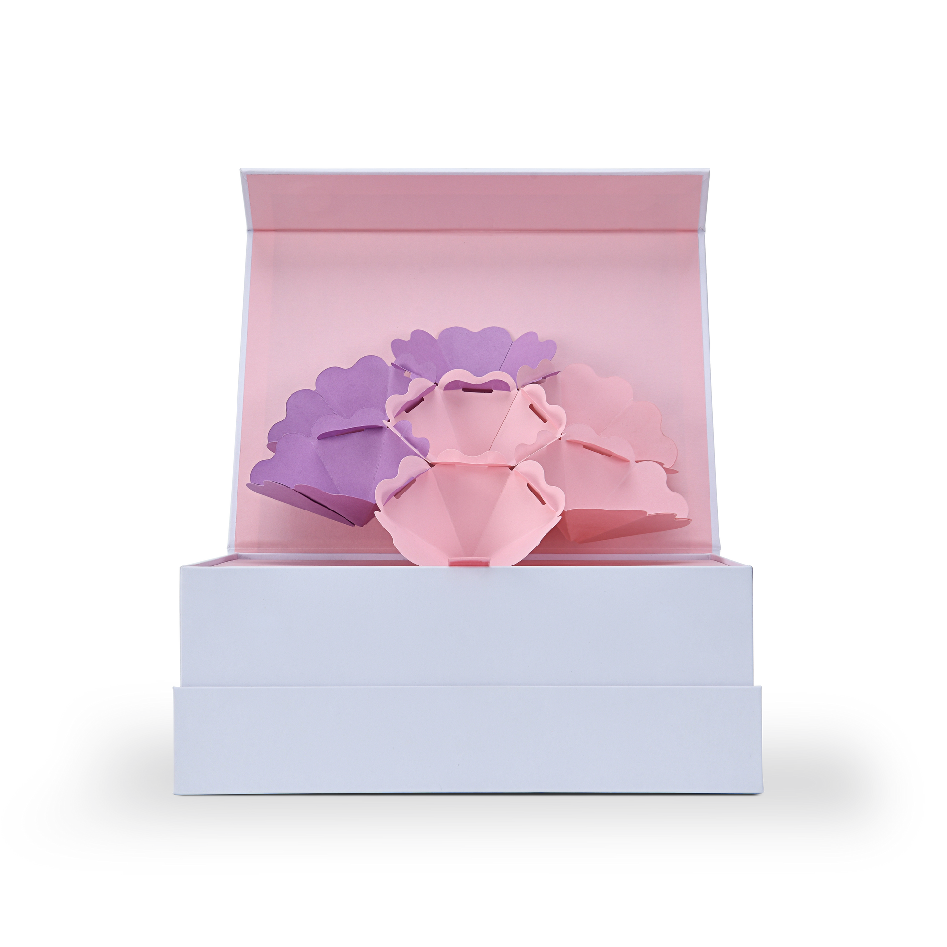 Front view of an opened magnetic gift box revealing a stunning 3D pop-up paper flower mechanism in pink and purple tones.