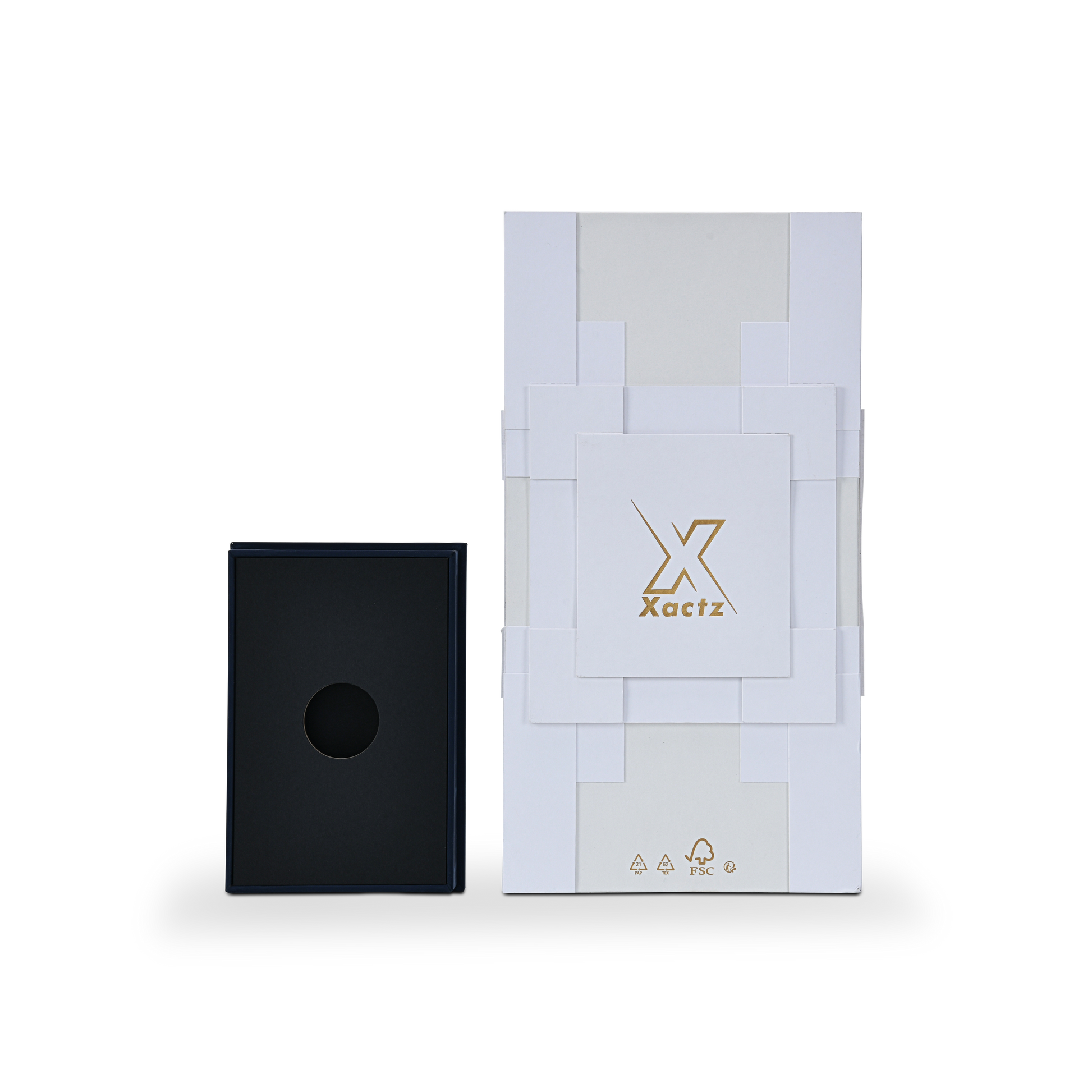 Overhead product presentation view showing the white geometric outer rigid box alongside a removable deep navy blue base insert with a circular bottle die-cut cutout.