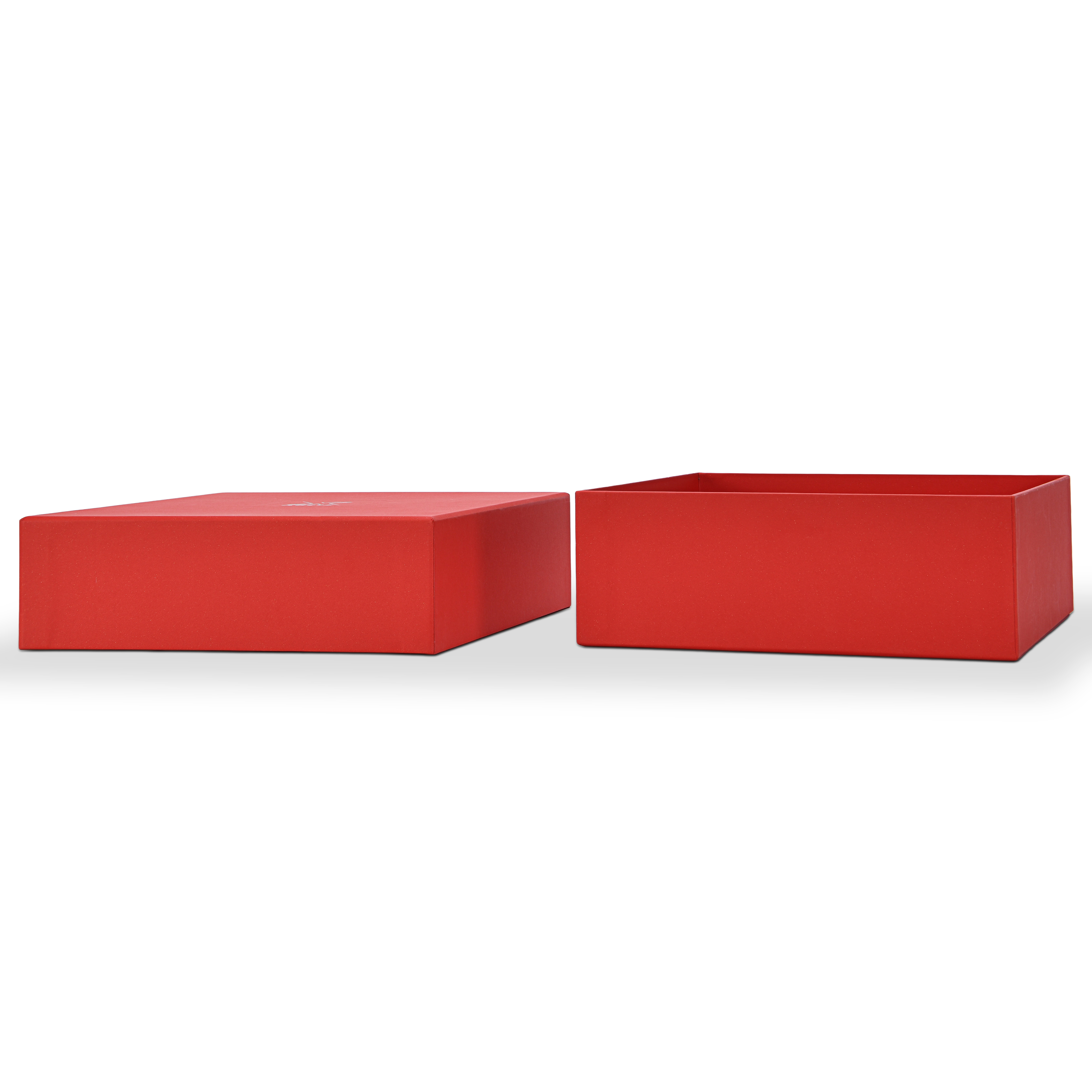 Side by side view of a custom red lid and base gift box for cosmetics with the lid and base fully separated and placed horizontally showing the clean deep red star rain specialty paper wrapping on both components and the precise fitted construction of the lid and base rigid box format