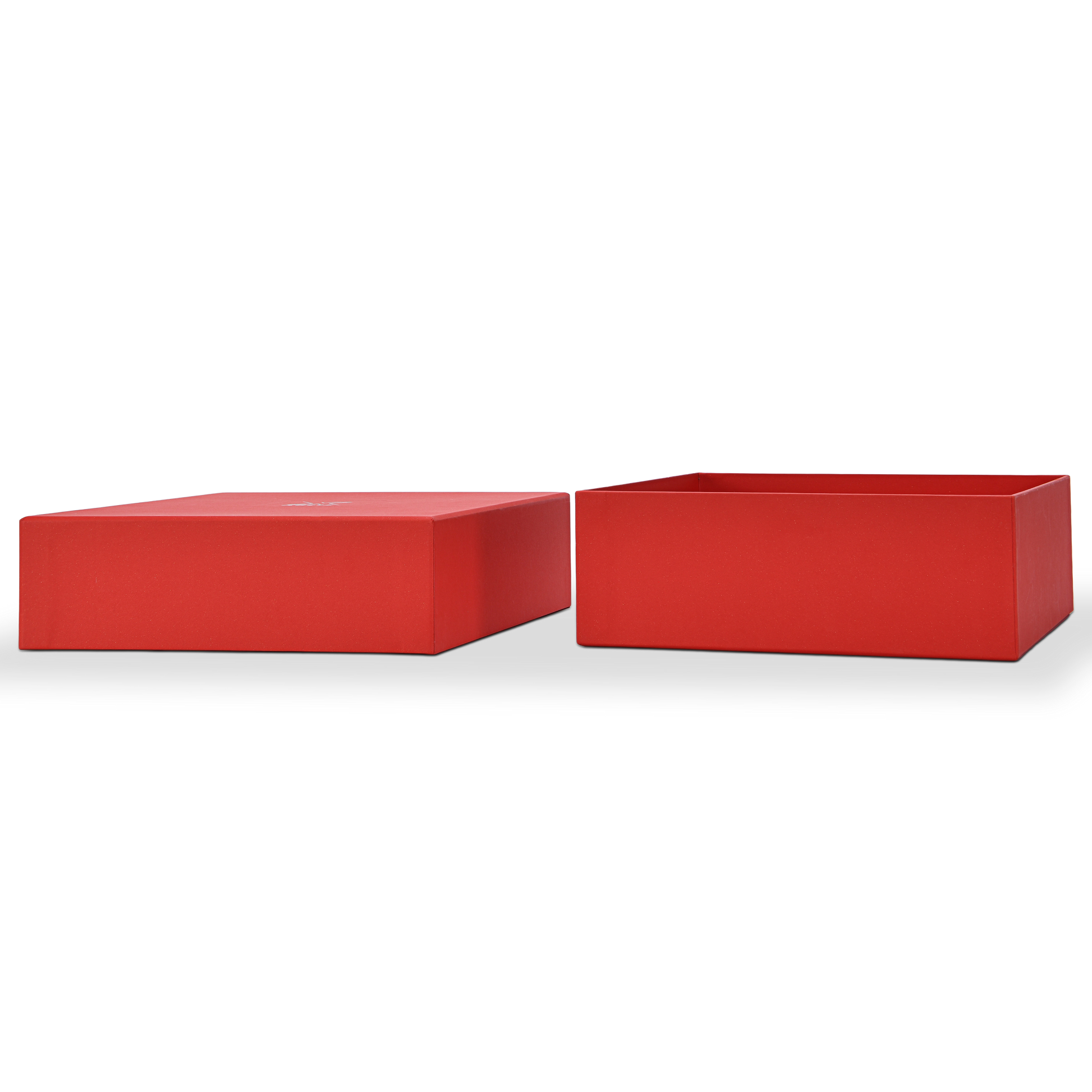 Side by side view of a custom red lid and base gift box for cosmetics with the lid and base fully separated and placed horizontally showing the clean deep red star rain specialty paper wrapping on both components and the precise fitted construction of the lid and base rigid box format