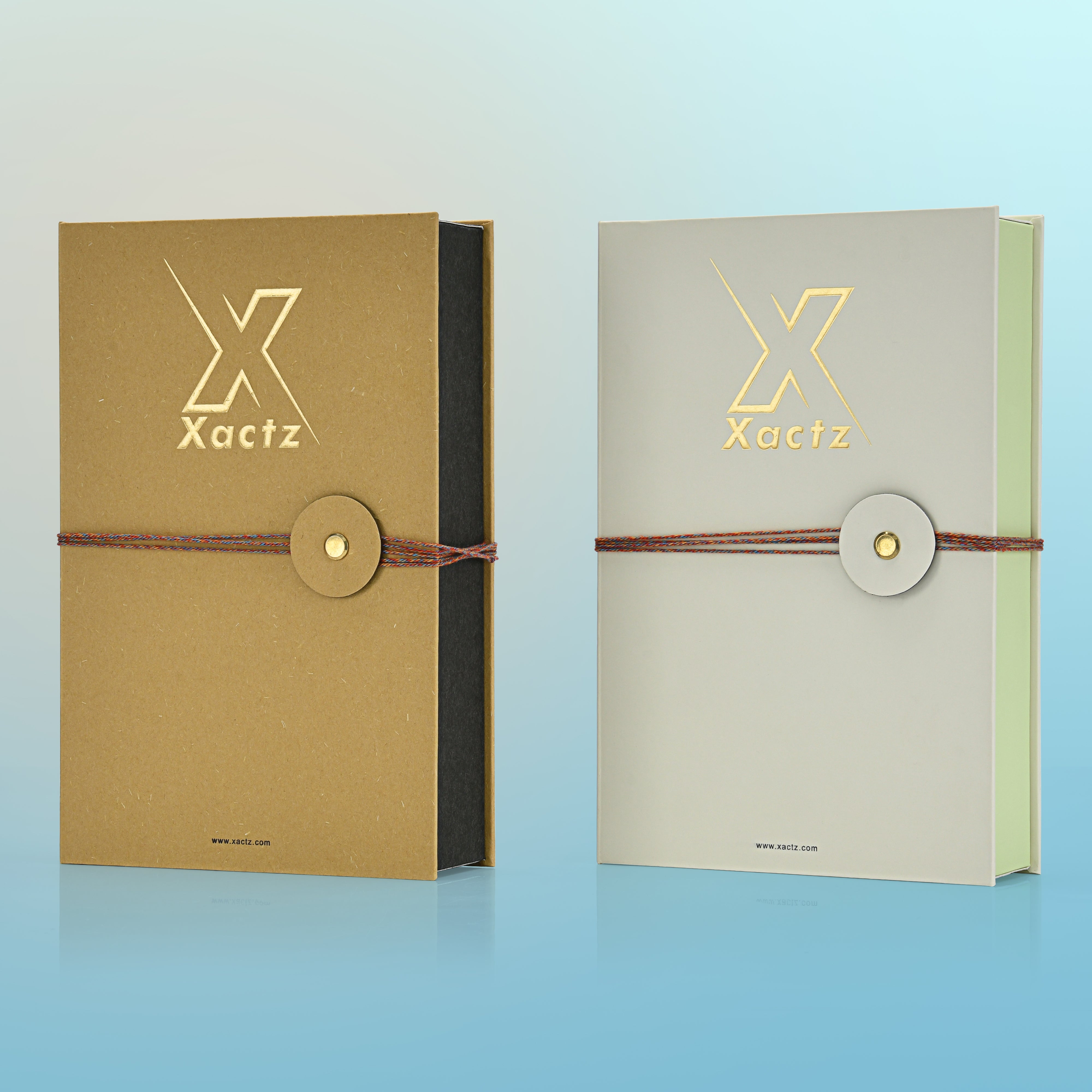 Angled front view of two custom book style fragrance boxes in ochre yellow and light grey showing the contrasting inner box colors of matte black and light green