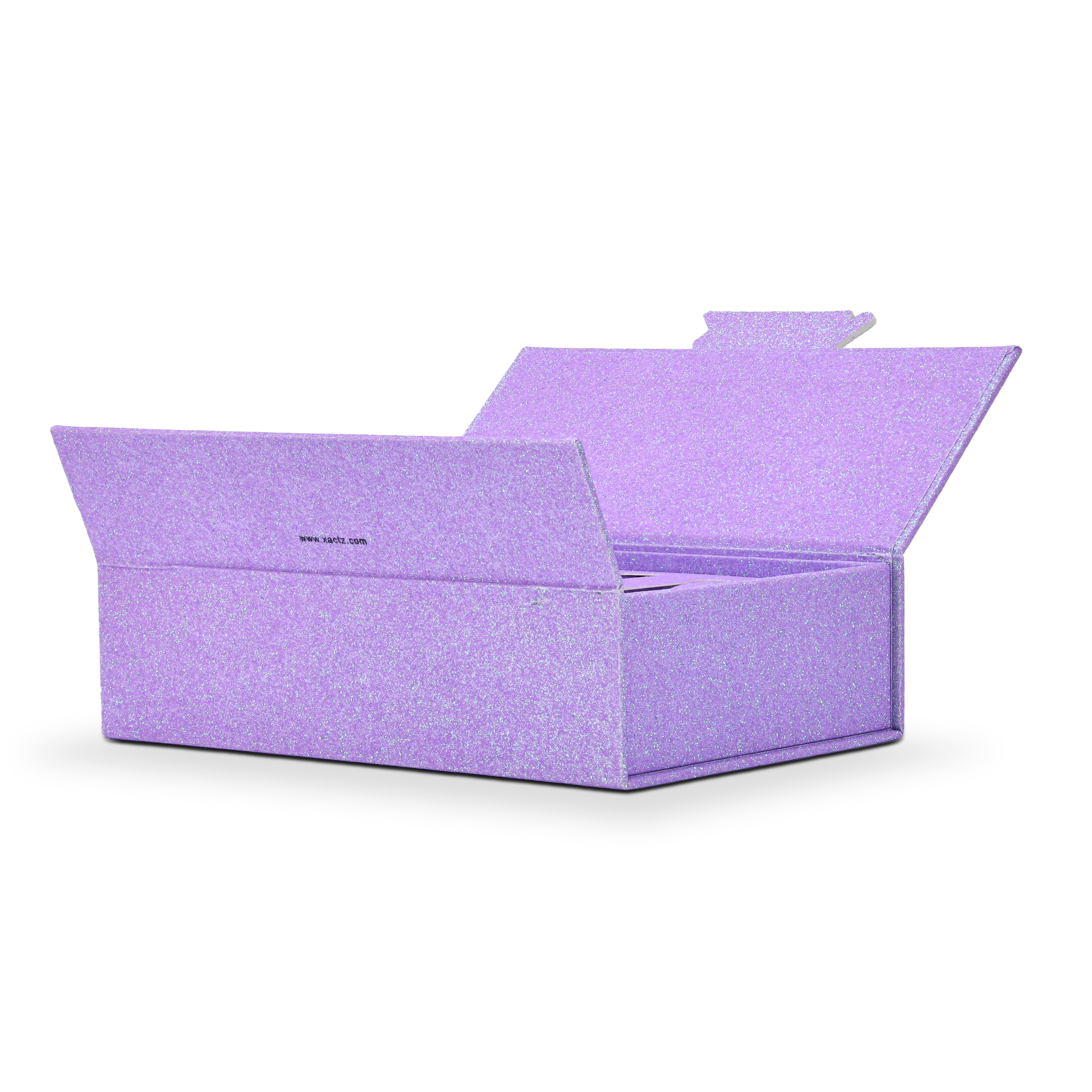 Wide angle three quarter view of an open custom purple glitter rigid makeup gift box with luxury packaging showing the full empty interior with the matching purple glitter lining wrapping all interior walls and the hinged lid fully open at an angle displaying the continuous iridescent purple glitter specialty paper surface from exterior through to interior