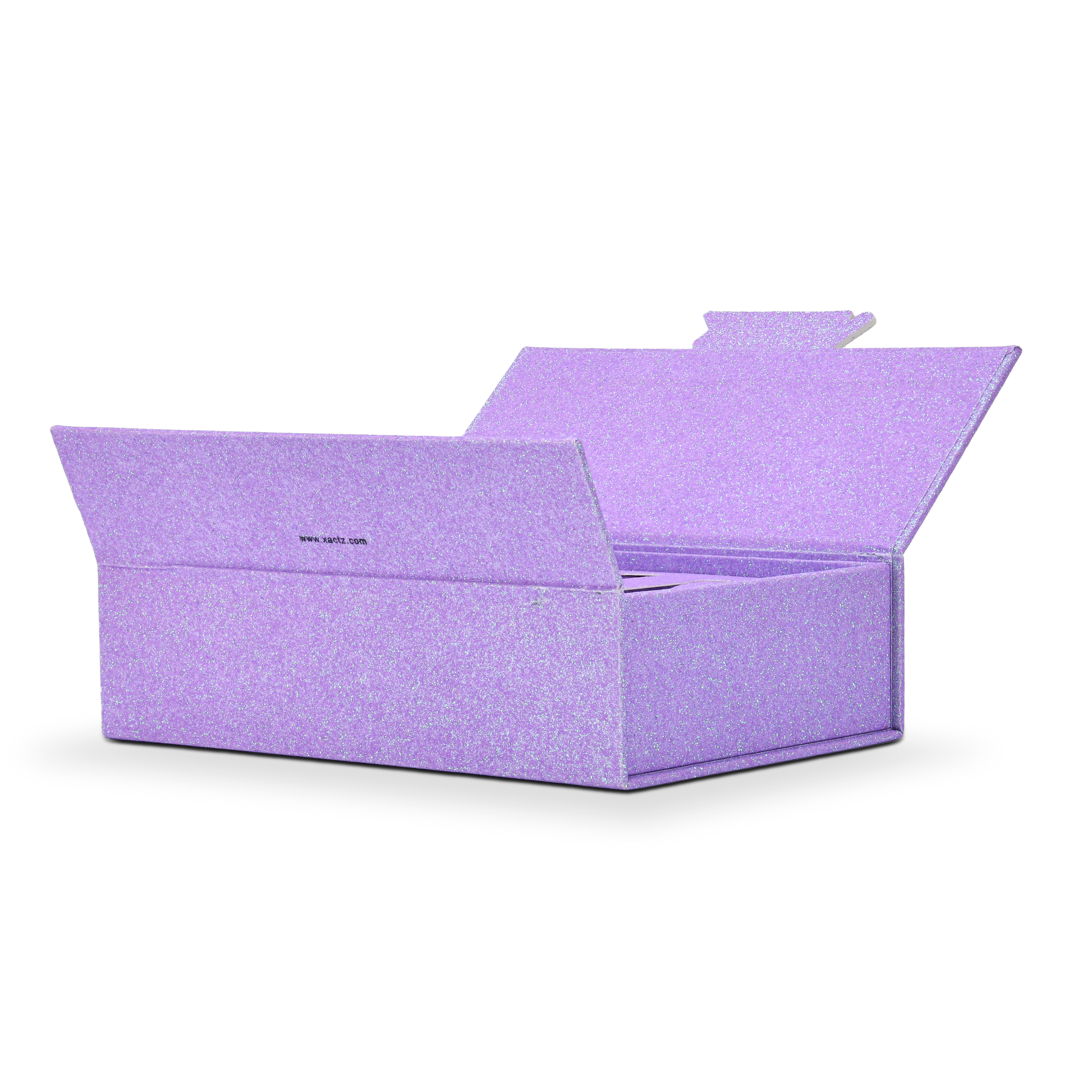 Wide angle three quarter view of an open custom purple glitter rigid makeup gift box with luxury packaging showing the full empty interior with the matching purple glitter lining wrapping all interior walls and the hinged lid fully open at an angle displaying the continuous iridescent purple glitter specialty paper surface from exterior through to interior