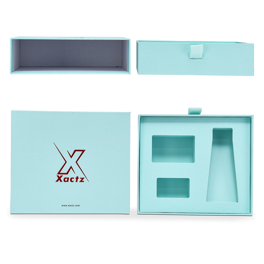 Confezione di lusso personalizzata in cartone con cassetto blu, nastro in lamina oro rosa e tessuto