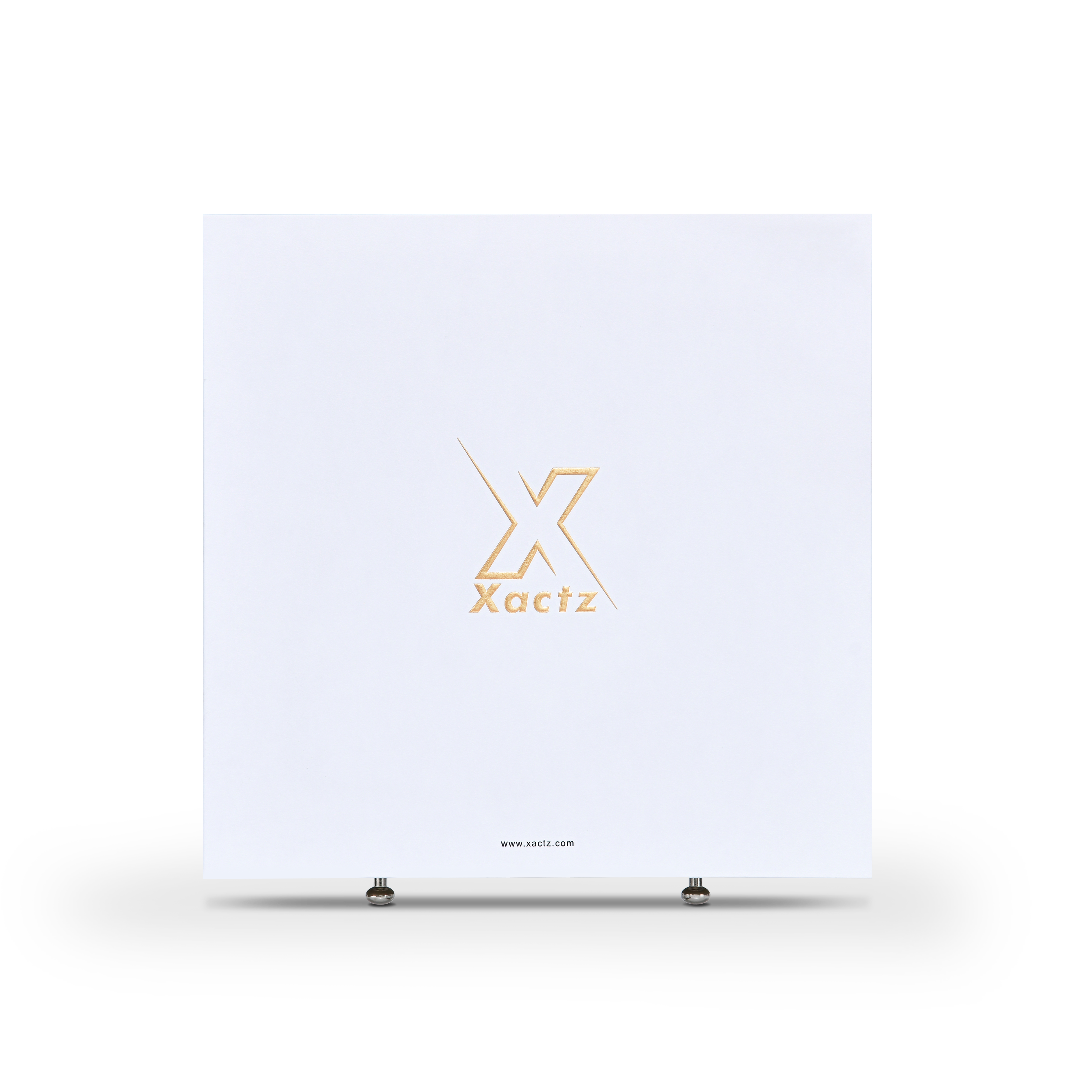 Front view of large square white Xactz rigid drawer box with gold foil logo and two silver pull beads at base.