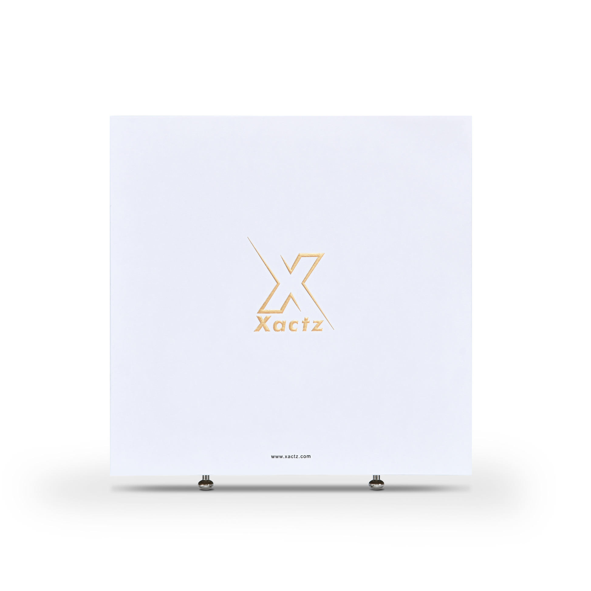 Front view of large square white Xactz rigid drawer box with gold foil logo and two silver pull beads at base.