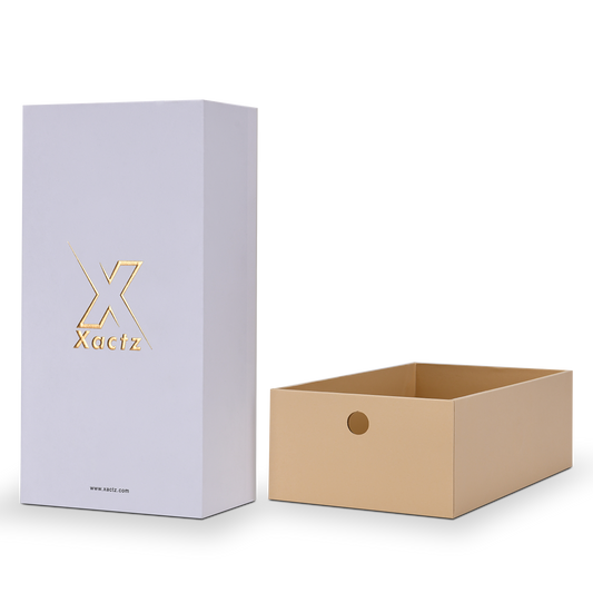 Lavender-white Xactz drawer box beside its separated warm beige inner tray, three-quarter view.